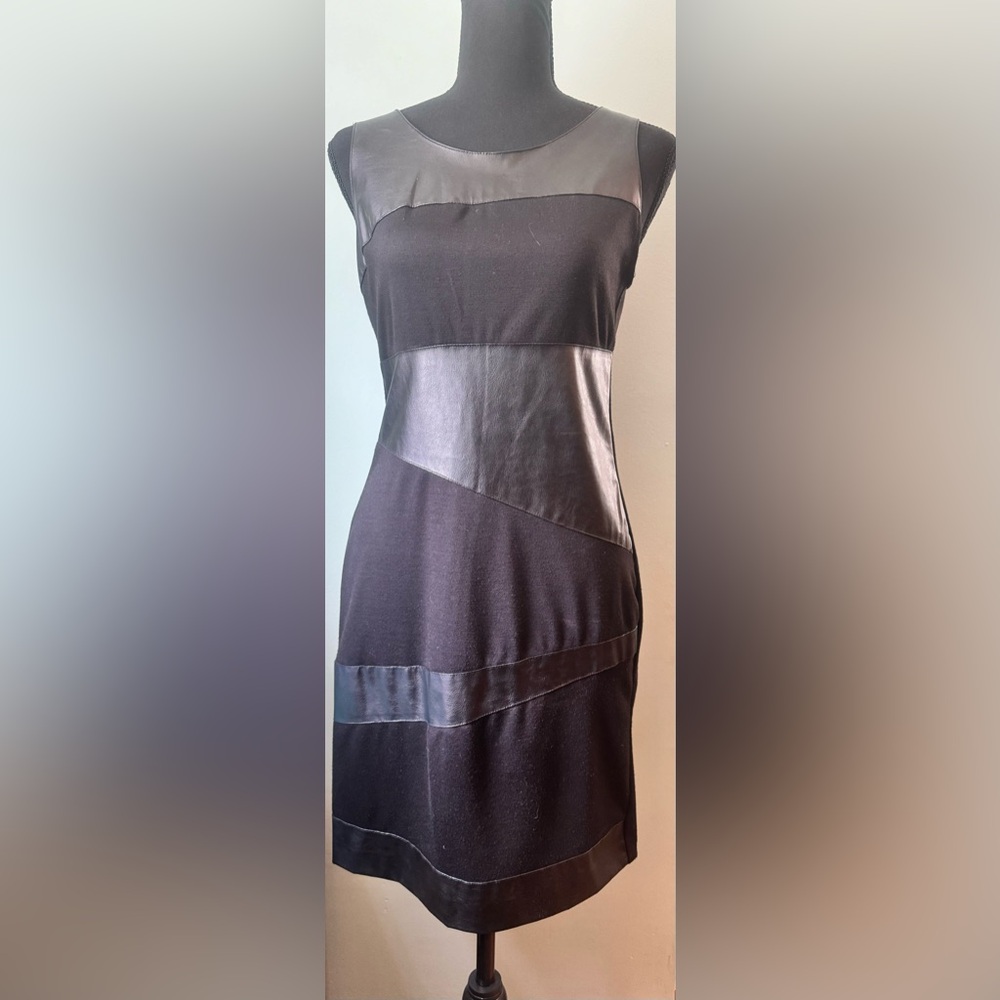 Black leather (partial) mini dress. Worn once. Zipper closure.